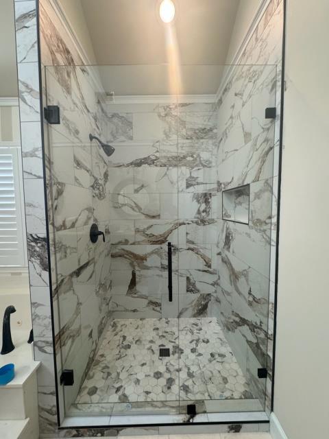 Installed the heavy glass shower enclosure in this bathroom in Roswell, GA to finish off giving the shower area a new look!