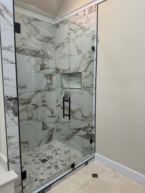 Installed the heavy glass shower enclosure in this bathroom in Roswell, GA to finish off giving the shower area a new look!