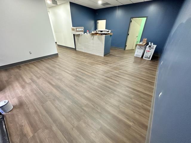 
I recently completed a flooring project for a commercial space. The previous flooring was concrete, but now it's been replaced with new LVP. The space needed some repairs and finishing touches, but will be open for business shortly. 