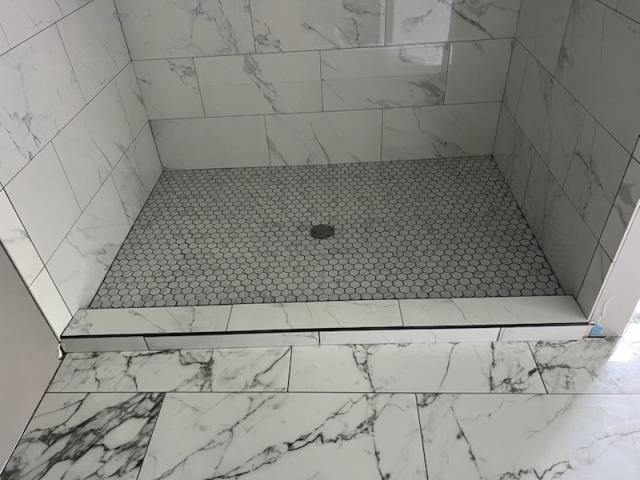 At this home in Bremen, GA we installed a new shower pan then tiled the bathroom floor, shower floor, and shower walls for this client and it turned out beautiful!