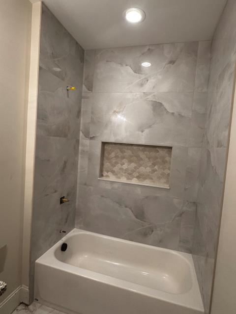 
We replaced the old tile in the guest bath with new tile on the floor and around the tub at this home in Alpharetta, GA.