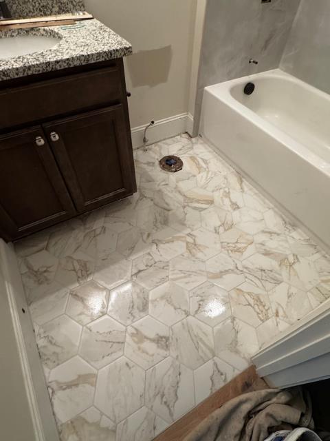 
We replaced the old tile in the guest bath with new tile on the floor and around the tub at this home in Alpharetta, GA.