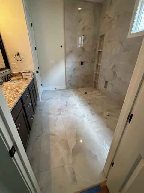 
We completely renovated the master bath in this Alpharetta, GA home, including a new zero-entry shower and custom niche - beautiful makeover.