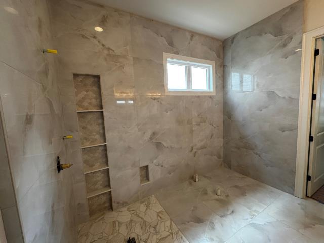 
We completely renovated the master bath in this Alpharetta, GA home, including a new zero-entry shower and custom niche - beautiful makeover.