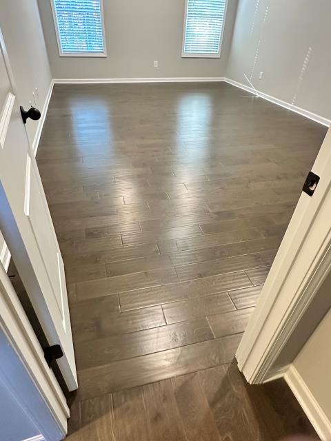 
We removed the carpet in the master bedroom and closet and installed glued down engineered hardwood that matches the other wood throughout the home in Palmetto, GA.