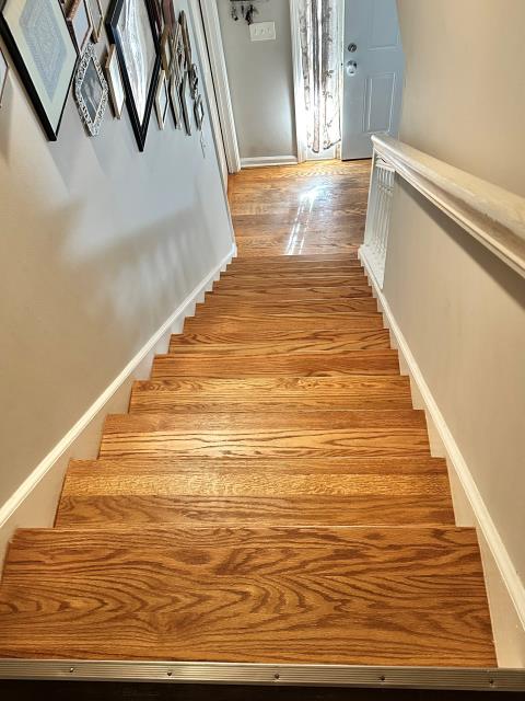 At this home in Villa Rica, GA we installed new oak stair treads and finished them to match the existing hardwood. We also installed one room of click/lock LVP.