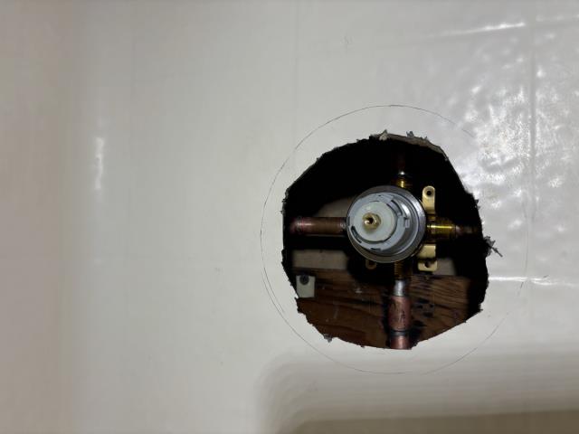 Bow Tie Plumbing has completed the replacement of the leaking Mixet shower valve. The existing valve was removed and upgraded with a new Delta pressure balance shower valve, trim, tub spout with diverter, and a basic shower head. The customer was given the option to retain the existing shower arm or replace it. A customer-supplied shower head was installed at no additional charge upon request.
To access the valve, the fiberglass shower enclosure was cut; an elongated retrofit cover plate was installed to conceal the new opening. A one-year warranty on workmanship is provided. Water shutoff for the work was scheduled and coordinated through the HOA for approximately half a day.