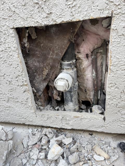 Call out to leak from upstairs to downstairs. Found leaking cracked abs pipe in wall at backyard clean out. No signs of water inside. Bow Tie plumbing will cut the stucco to access the pipe and repair the leaking section of abs by replacing it with new pipe and fittings. A test will be run after work is complete to ensure no further leaks. Technician cut open stucco approximately 1 foot by 2 foot opening to find cracked sanitary tee at the hub. Replaced with a new 1.5”x2”x2” sanitary tee fitting and clean out cap. 1 year warranty on workmanship. Stucco patch not include in this price.