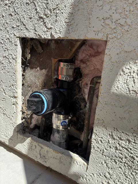 Call out to leak from upstairs to downstairs. Found leaking cracked abs pipe in wall at backyard clean out. No signs of water inside. Bow Tie plumbing will cut the stucco to access the pipe and repair the leaking section of abs by replacing it with new pipe and fittings. A test will be run after work is complete to ensure no further leaks. Technician cut open stucco approximately 1 foot by 2 foot opening to find cracked sanitary tee at the hub. Replaced with a new 1.5”x2”x2” sanitary tee fitting and clean out cap. 1 year warranty on workmanship. Stucco patch not include in this price.