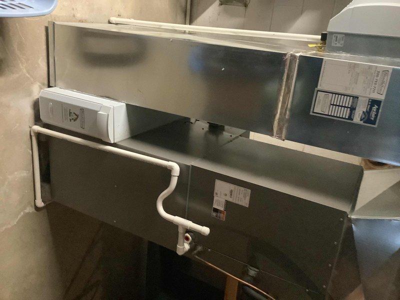 Conducted site assessment for potential whole-house dehumidifier installation. Evaluated existing HVAC system with metal ductwork and PVC drain lines in utility room. Identified suitable connection points and assessed electrical requirements for integration with current setup.