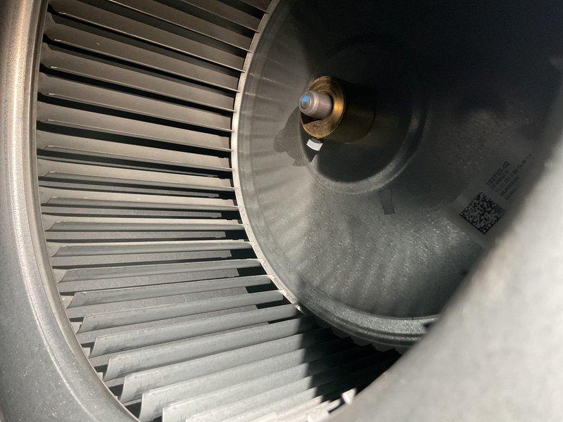 Performed routine MVP heating maintenance service that had been rescheduled from 11/12. Inspected blower wheel assembly, noting clean condition with no visible debris or buildup on the fan blades or housing. Used hex key tool to access and service internal components during the maintenance visit.