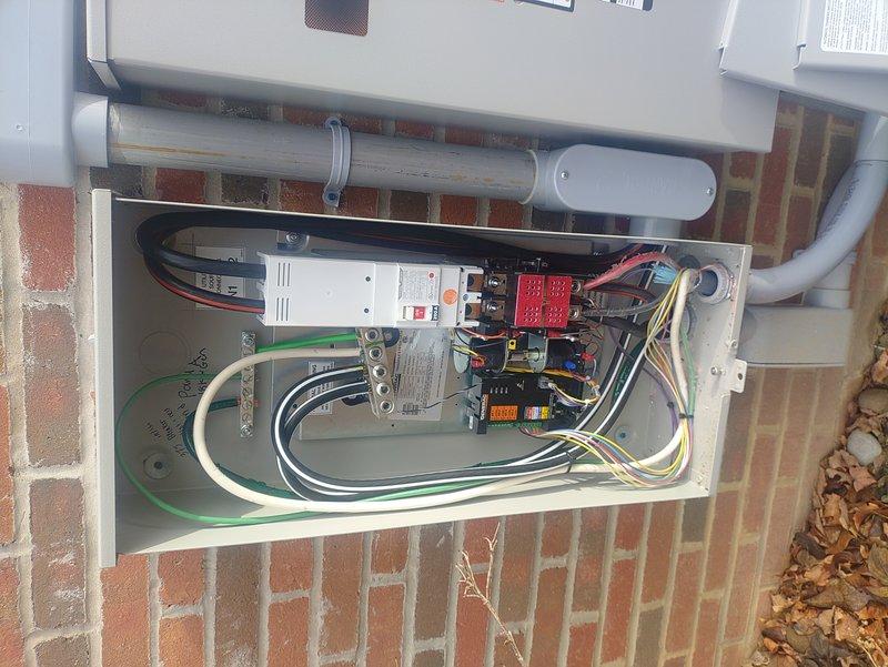 Conducted re-inspection of dual generator installation that had previously failed inspection. Identified and documented multiple safety issues including loose lugs which presented a significant hazard. Performed necessary corrections including tightening of loose connections in electrical panels. Unable to complete full inspection due to no access to basement panel. Provided detailed documentation with photos to contractor for remaining required corrections.