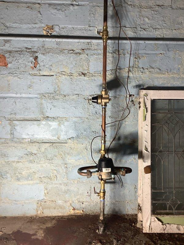 Completed installation of a new 40-gallon Bradford White water heater with 6-year warranty, including new shut-off valves and thermal expansion tank. Also replaced main water supply valve with new quarter-turn ball valve and installed pressure reducing valve for improved water pressure regulation.