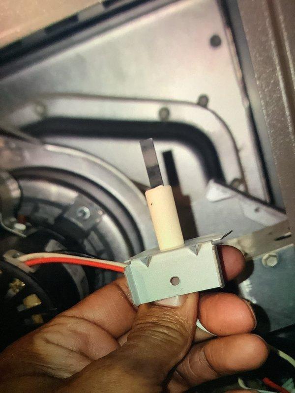 Responded to customer report of furnace shutting down with error code E290. Inspected system and found damaged red wire previously repaired with electrical tape. Replaced faulty igniter assembly and tested system operation. Unit now functioning properly with no error codes present.