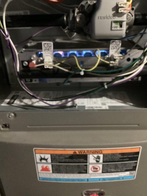 Performed standard furnace tune-up service on a 2-year-old unit. Inspected control boards, connections and electrical components, noting all indicator lights functioning properly with organized wire management. Examined and cleaned air filter housing; filter appears in serviceable condition. All systems operating within normal parameters.