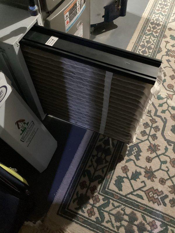 Performed standard furnace tune-up service on a 2-year-old unit. Inspected control boards, connections and electrical components, noting all indicator lights functioning properly with organized wire management. Examined and cleaned air filter housing; filter appears in serviceable condition. All systems operating within normal parameters.