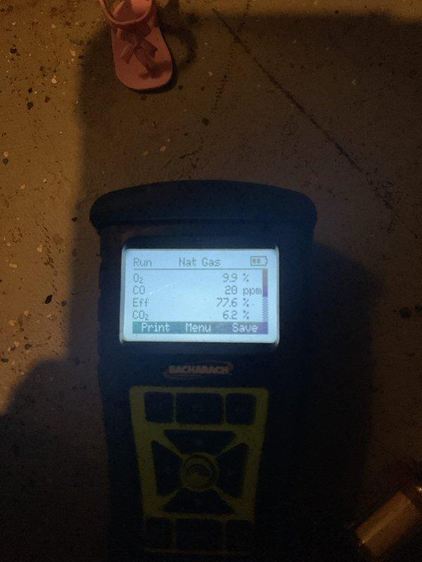Completed MVP heating system inspection and combustion analysis. Gas analyzer readings showed proper operation with 77.6% efficiency, CO2 at 6.2-6.3%, and CO at 20 ppm with stack temperature at 410°F, all within acceptable ranges for a natural gas system.