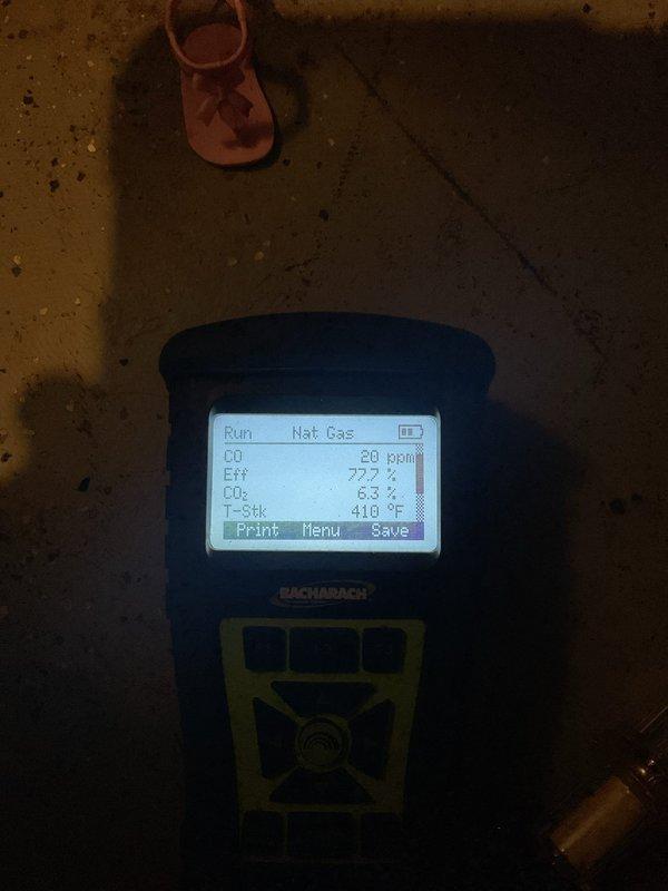 Completed MVP heating system inspection and combustion analysis. Gas analyzer readings showed proper operation with 77.6% efficiency, CO2 at 6.2-6.3%, and CO at 20 ppm with stack temperature at 410°F, all within acceptable ranges for a natural gas system.