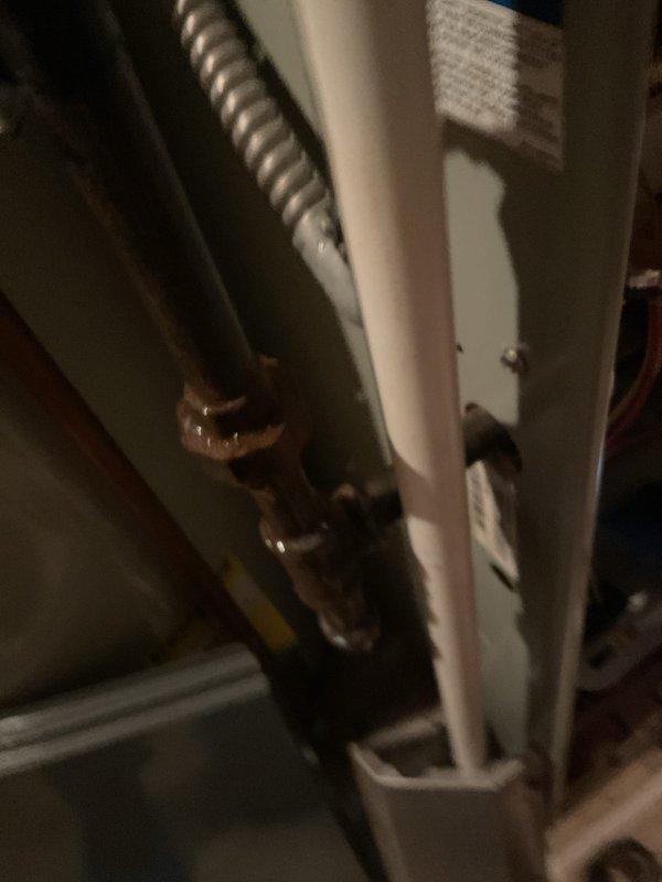 Performed routine maintenance on gas furnace of undetermined age. Inspected air filter, which showed normal dust accumulation, and examined heat exchanger connections. Noted some mineral buildup at copper pipe fittings that should be monitored but are functioning properly. System is operational and working as expected.