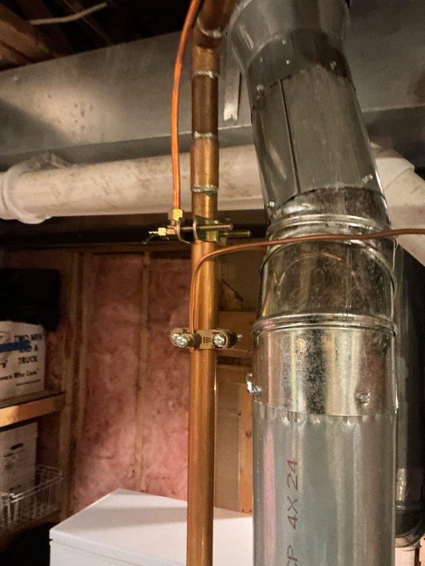 Diagnosed and repaired water heater with melted plastic rings on one side. Inspected ventilation system, including galvanized flue pipe and copper supply lines, to identify heat transfer issues causing plastic component damage. Replaced damaged parts and verified proper ventilation clearance to prevent future overheating problems.
