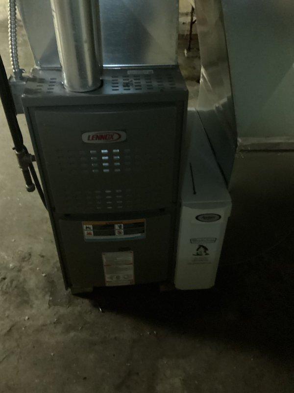 Performed routine maintenance service on Lennox furnace system in basement. Inspected unit functionality, checked ventilation systems, and replaced filter with Spaceguard 413 model. System appears to be operating within normal parameters with humidifier attachment in good working condition.