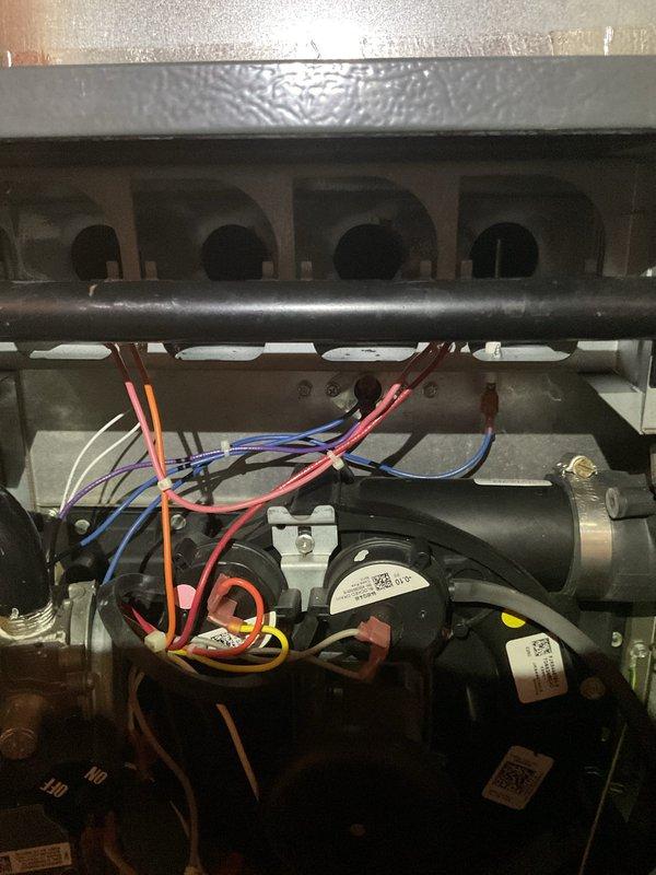 Performed routine heating maintenance service on a 9-year-old system. Inspected electrical components including wire connections, capacitor, and motor assembly. Examined blower motor and internal wiring harness for proper function and condition. All components operating within normal parameters at time of service.