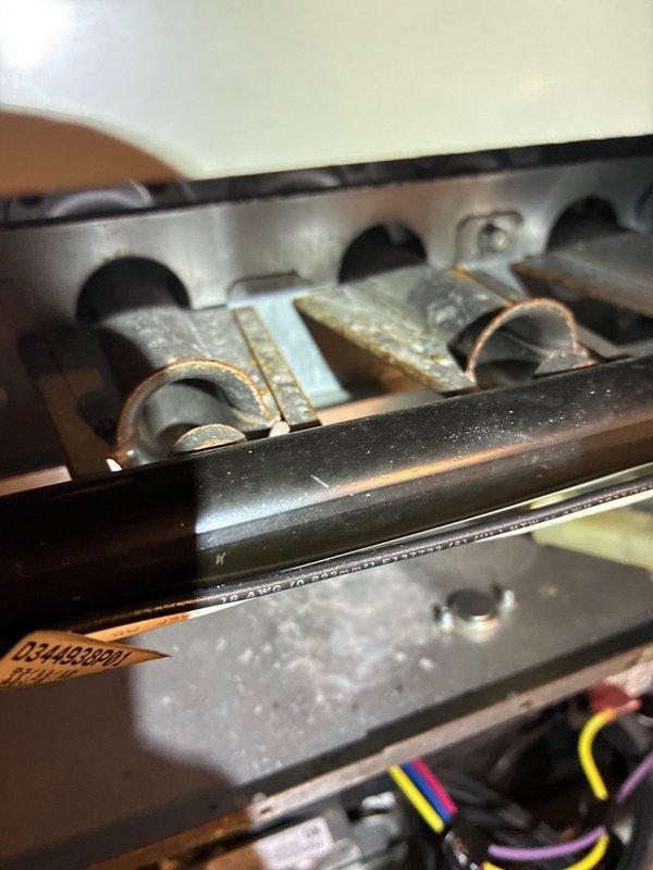 Performed scheduled MVP Heating maintenance on two HVAC systems, including inspection of a Trane furnace unit. Documented significant corrosion and oxidation on burner tubes and heating elements that indicate aging components. Observed proper installation of PVC exhaust venting system and documented current system condition for future service reference.