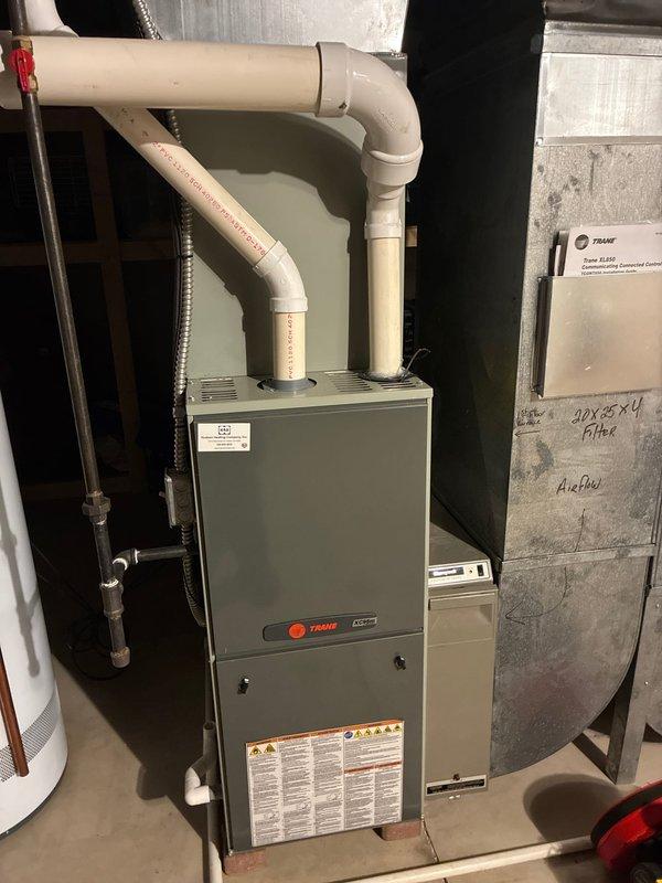 Performed scheduled MVP Heating maintenance on two HVAC systems, including inspection of a Trane furnace unit. Documented significant corrosion and oxidation on burner tubes and heating elements that indicate aging components. Observed proper installation of PVC exhaust venting system and documented current system condition for future service reference.