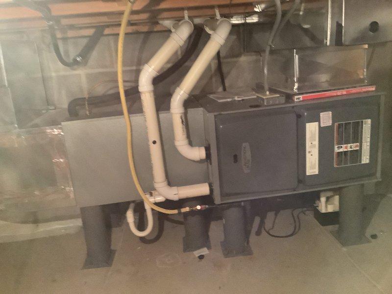 Completed installation of a high-efficiency 90% Furnace and Air Conditioning system. Installed the outdoor condenser unit on paver stones with proper electrical connections at the exterior wall. Mounted the new furnace in the basement with dual PVC venting and connected all necessary ductwork and control wiring.