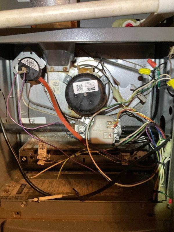 Conducted emergency inspection of furnace in response to reported operational concerns. Performed comprehensive efficiency and safety check, including thorough examination of pressure switches, blower motors, and gas valve components. Visual inspection revealed all electrical connections and wiring (orange, yellow, green, purple) to be intact with no signs of damage requiring immediate attention.