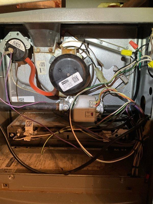 Conducted emergency inspection of furnace in response to reported operational concerns. Performed comprehensive efficiency and safety check, including thorough examination of pressure switches, blower motors, and gas valve components. Visual inspection revealed all electrical connections and wiring (orange, yellow, green, purple) to be intact with no signs of damage requiring immediate attention.