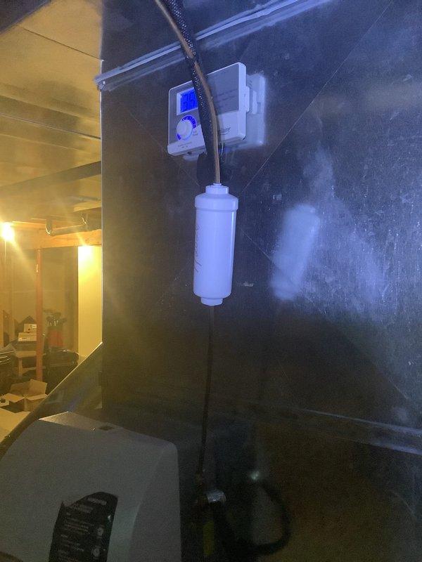 Returned to customer's residence to replace the inline water filter as scheduled. Successfully installed the new filter component connected to the existing plumbing system with proper copper pipe connections. The monitoring control unit with digital display is now operational and properly mounted, with all connections secure and system functioning as designed.