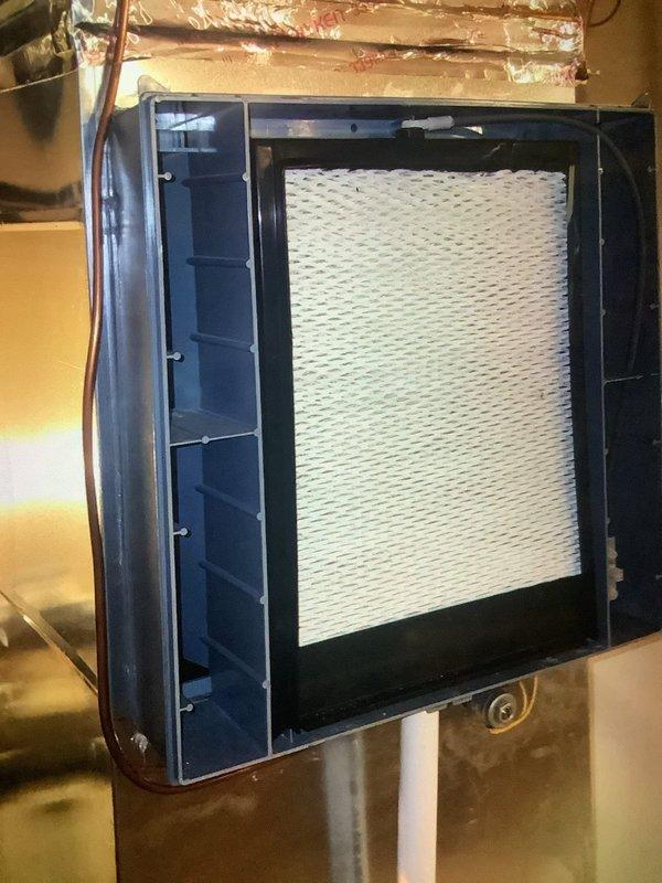 Completed routine MVP Heating maintenance service on a one-year-old system. Inspected air handler and filter housing, confirming filter is clean and properly installed. Measured temperature differential with UEi EM201B meter showing +35.10°F, indicating system is operating within normal parameters.