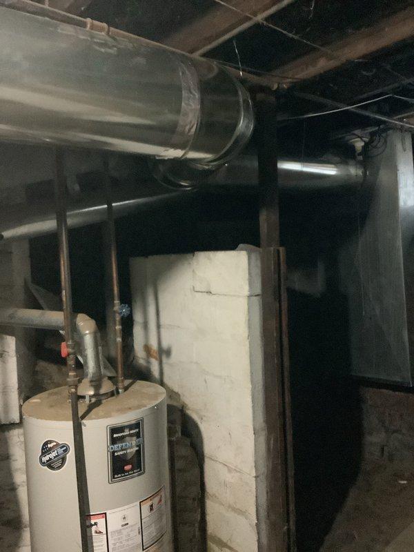 Completed installation of new return ductwork system in basement mechanical room, incorporating panning techniques and installation of a new 2410 unit. Work included connecting the system to existing HVAC infrastructure with proper metal ducting, joints, and elbow connections to ensure optimal airflow throughout the property.