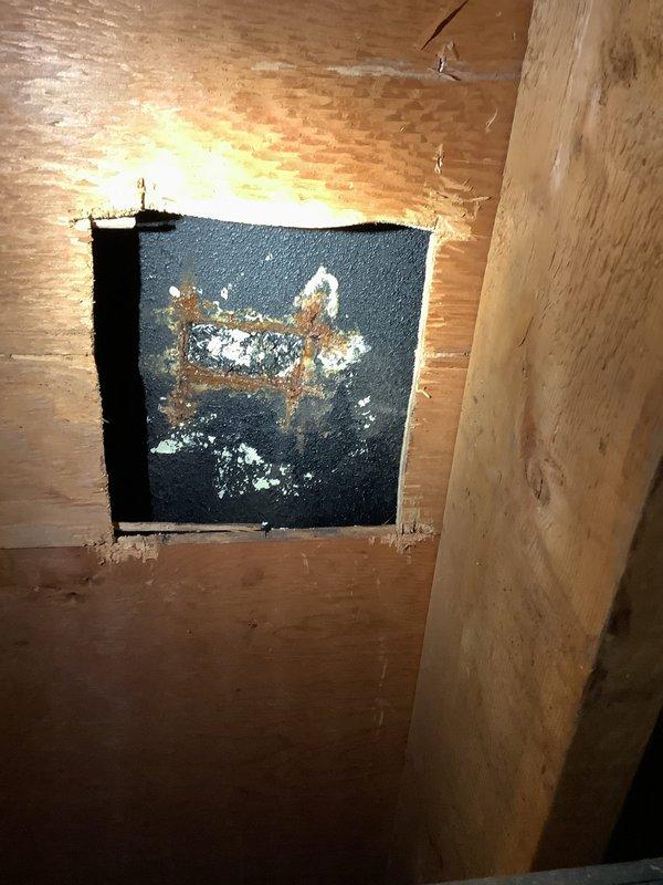Responded to service call for bathtub leak penetrating into basement of 64-year-old home. Upon inspection, identified deteriorated valve assembly and drain components. Created access panel to investigate plumbing infrastructure, revealing significant corrosion at connection points and worn seals. Replaced valve cartridge, installed new gaskets, and resealed drain assembly to prevent further water intrusion to lower level. Confirmed repair with pressure test showing no further leakage.