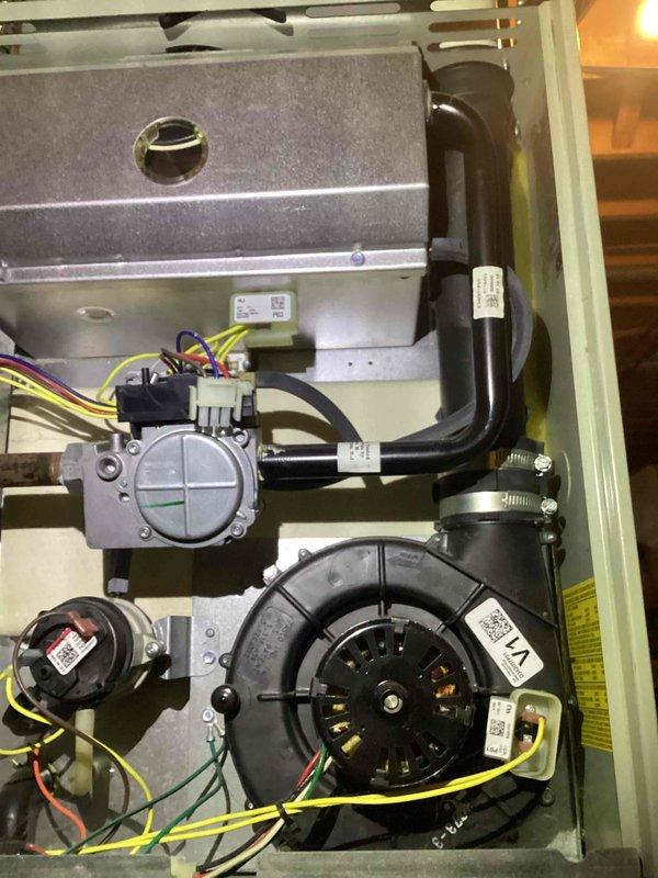 Performed preventative maintenance on 11-year-old gas furnace with MVP motor. Inspected blower motor assembly, control board connections, and electrical components. All systems functioning normally with no visible issues detected.