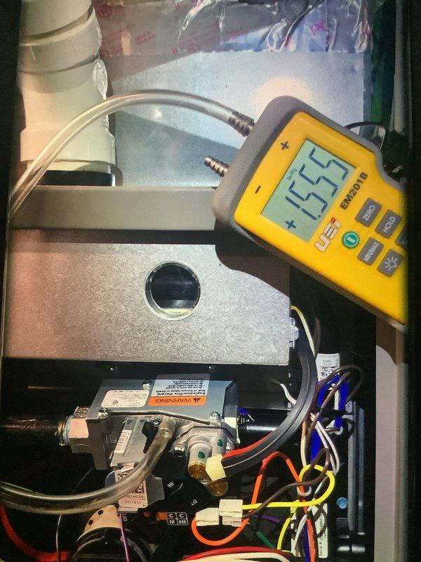 Performed scheduled MVP furnace maintenance. Conducted gas pressure test with digital gauge, obtaining reading of 1.55" WC. Inspected gas valve assembly, electrical terminals, and associated plumbing components. All connections, valves, and fittings found in proper working condition with no leaks detected.