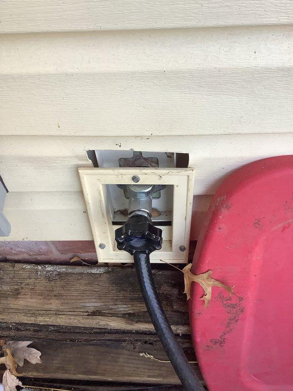 Diagnosed and repaired leaking outdoor water spigot attached to vinyl siding on 70-year-old home. Replaced deteriorated valve assembly and gaskets in the existing hose bib housing, eliminating persistent drip that had recurred after previous repair. Tested water flow and pressure to confirm proper operation with no further leakage.