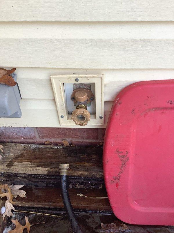 Diagnosed and repaired leaking outdoor water spigot attached to vinyl siding on 70-year-old home. Replaced deteriorated valve assembly and gaskets in the existing hose bib housing, eliminating persistent drip that had recurred after previous repair. Tested water flow and pressure to confirm proper operation with no further leakage.