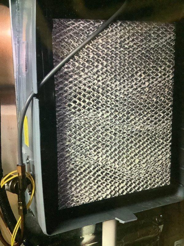 Performed scheduled furnace maintenance on a 5-year-old system. Inspected Aprilaire whole-home humidifier and verified proper connection to ductwork. Examined furnace filter which showed normal dust accumulation and replaced as part of routine maintenance.