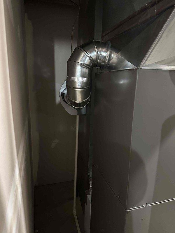 Installed new Aprilaire model 600 whole-home humidifier with all accompanying components on existing HVAC system per previous quote. Installation included proper connection of water supply line and integration with the home's ductwork system, utilizing a 90-degree elbow joint to ensure optimal airflow and humidity distribution.