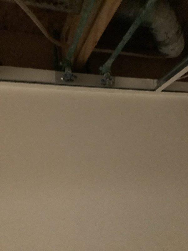 Responded to service call for reported water line leak between washer and refrigerator. Upon inspection, identified water damage in ceiling and stairwell area, indicating possible hidden plumbing leak. Located and repaired compromised water supply line, securing connections and testing system for proper operation with no further leakage.