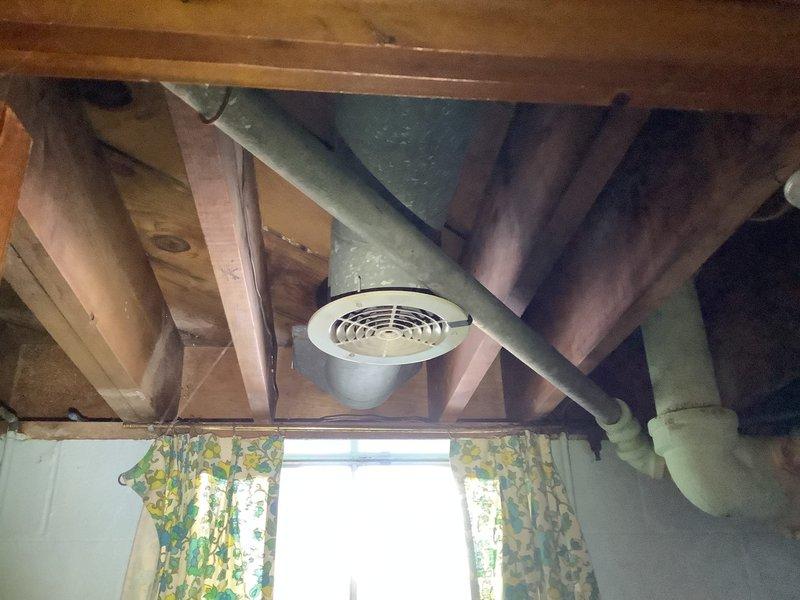 Responded to service call for MVP customer with clogged bathtub drain and garbage disposal issues. Inspected existing plumbing infrastructure in basement/crawl space, including cast iron and PVC drainage components. Discovered ventilation system integration with drainage architecture that was contributing to clogging issues. Successfully cleared bathtub drain obstruction and verified proper function of garbage disposal unit.