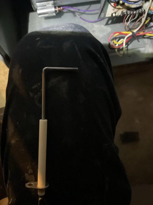 Performed scheduled heating system maintenance visit. Accessed control panel to inspect electrical connections and components. Used hex key tool to secure loose connections, ensuring proper system operation and safety.