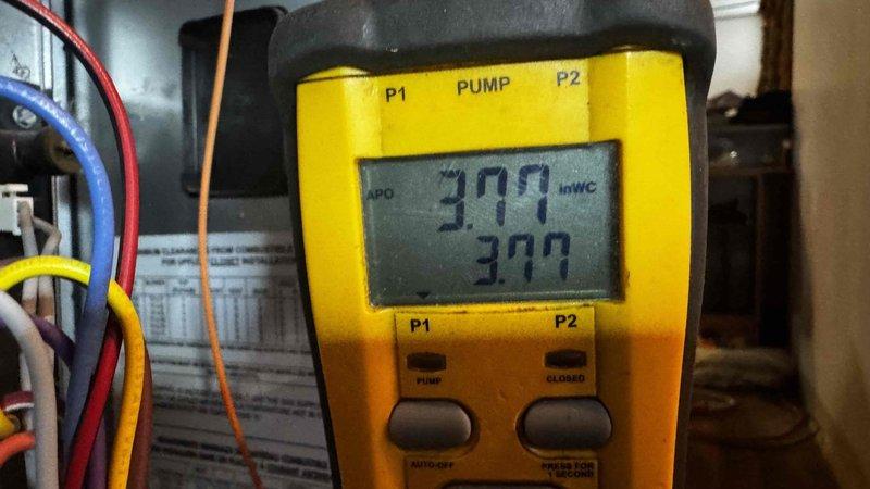 Responded to customer complaint of furnace blowing cold air. Upon inspection, identified the problem was not with the furnace but with the Rheem Professional water heater showing signs of corrosion at connection points. Tested gas pressure with manometer, recording readings of 309 and 399 inWC, confirming improper pressure levels. Adjusted pressure settings to manufacturer specifications to restore proper heating function.