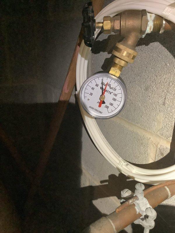 Replaced ruptured 2.1-gallon pressure tank in utility room. Installed new pressure tank to existing PVC and copper pipe system. Verified proper pressure readings on gauge after installation.