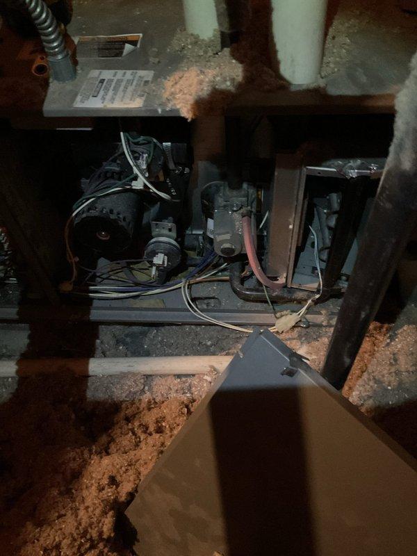 Performed 8:00 AM maintenance service on attic furnace unit, confirming proper operation of reheat function. Visual inspection revealed Lennox system with exposed components and displaced insulation around the unit that was subsequently addressed during service.