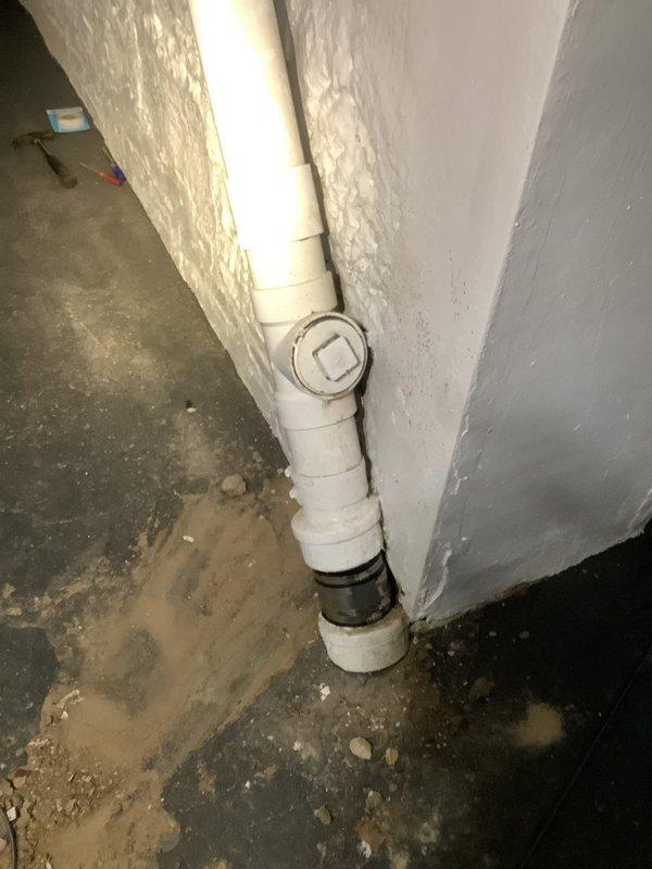 Performed camera inspection of main drain line after customer reported possible clogging issue. Located main cleanout access point in basement along with floor drains showing signs of backup/mineral deposits. Visual inspection revealed sediment accumulation at pipe base and discoloration around drain openings, consistent with periodic drainage issues.