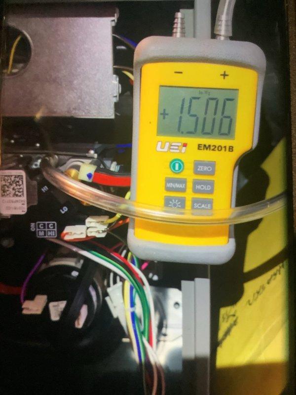 Performed annual maintenance on Bryant/Carrier system unit. Visual inspection revealed system in good condition. Measured static pressure reading of 15.06 using UEi EM201B meter. All components functioning properly with no issues detected. Documented unit condition with photos for service record.