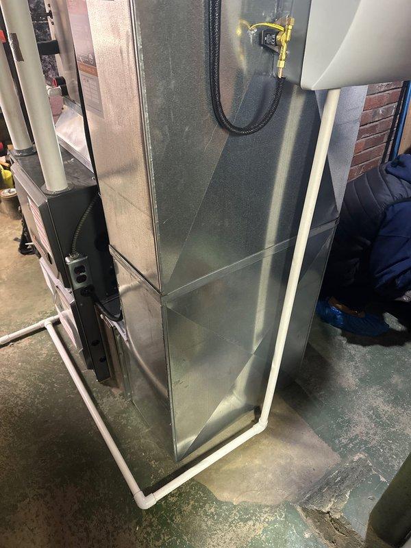 Successfully installed an AprilAire 600 humidifier with digital control panel (model 60) on the client's HVAC system. The unit is functioning properly with humidity reading at 39% and the "Humidifier On" indicator illuminated. Installation included proper connection of water supply, drainage, and electrical components with all connections secured and tested.